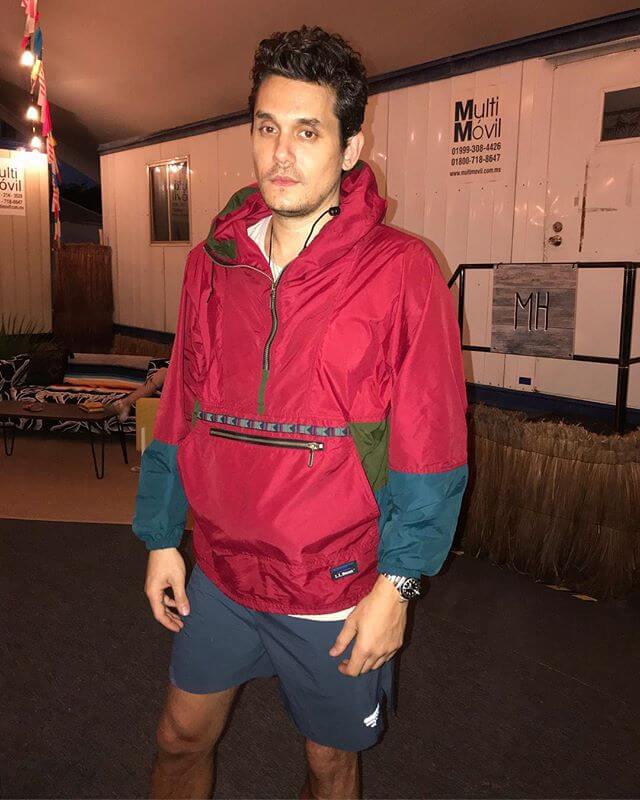 About to play, in a vintage bean anorak and running shorts