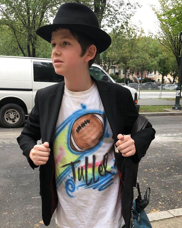 when i was a young yeshiva student we weren’t allowed to wear t shirts. This young bachur was probably home on vacation. Still cool his parents allowed. Mine did too but neighbors would always snitch to rabbis/principles
Editors Note: T was a souvenir from his friends bar mitzvah