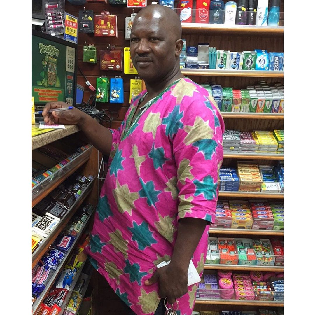 His shirt (from Nigeria) was the exact same colors of the lottery paper he was filling out.